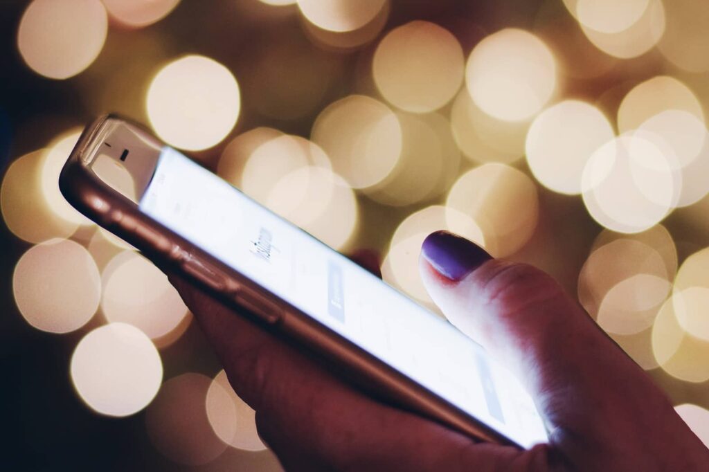 Closeup of female hand holding a mobile phone.